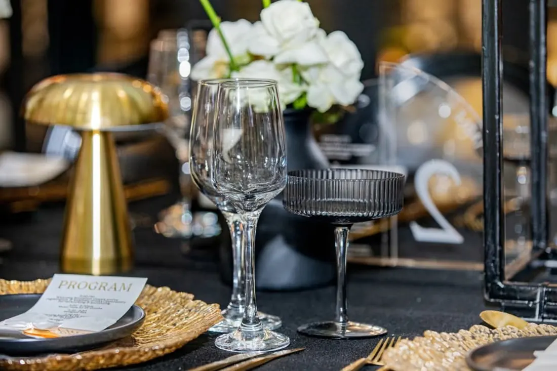 Actual elegant glassware and black-and-gold table styling