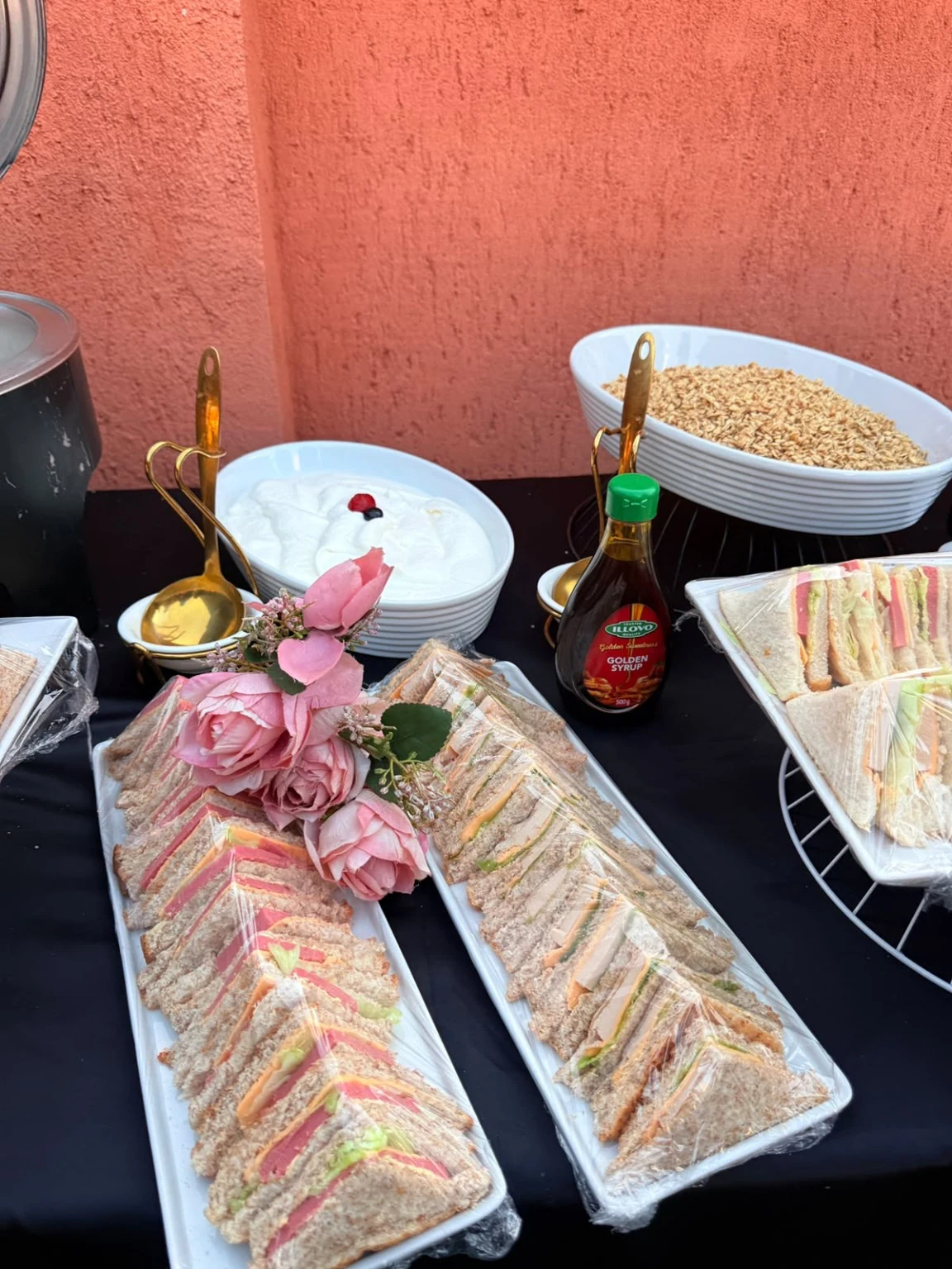 Freshly arranged finger sandwiches and buffet accompaniments served with delicate floral touches.