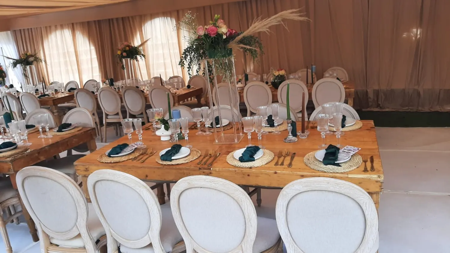 A Room Reimagined. Coordinated chair styling, soft light and abundant florals create something truly special.