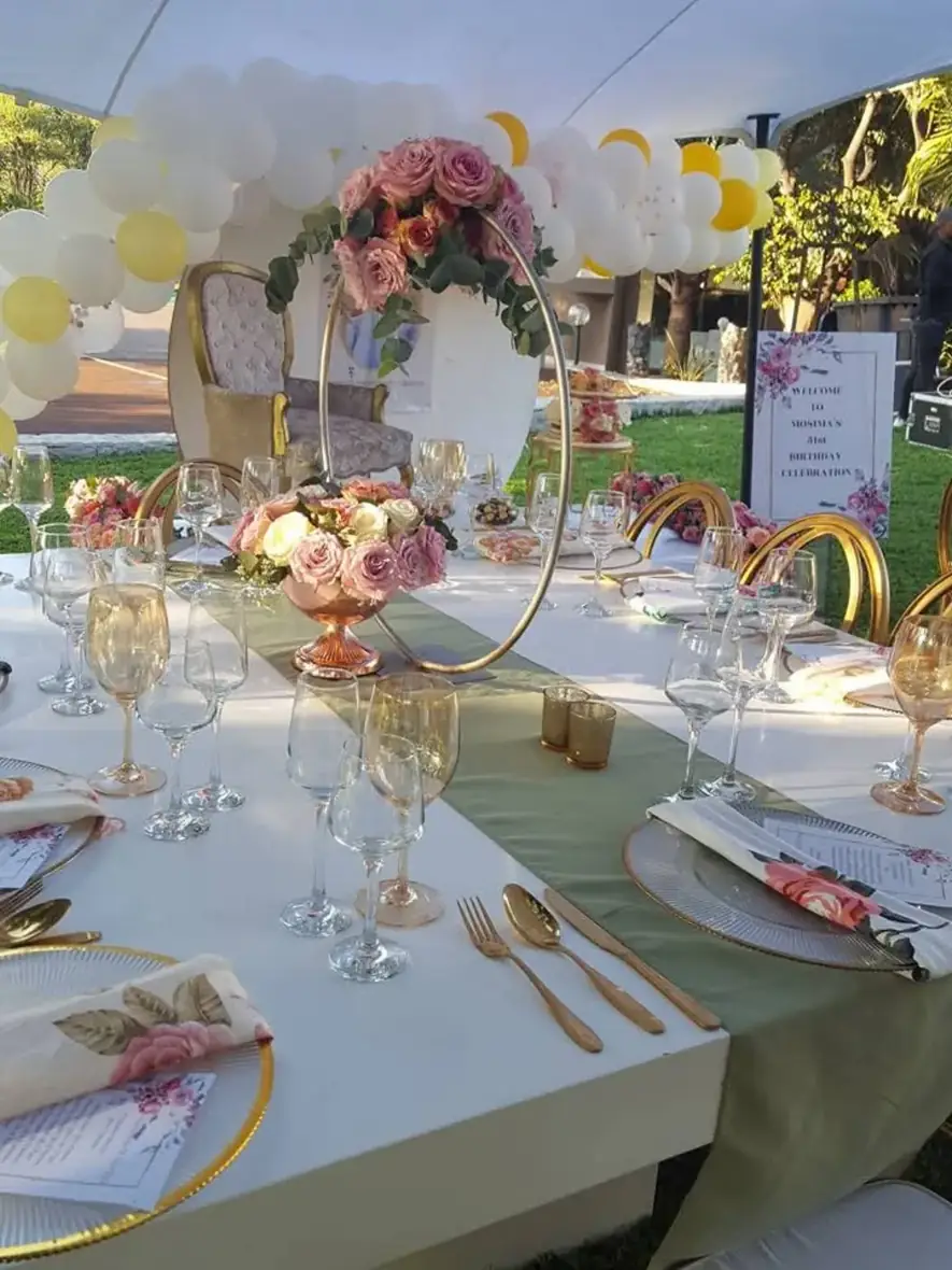 Romantic Outdoor Tables. A refined outdoor table composed of blossoms, soft shades and gold accents.