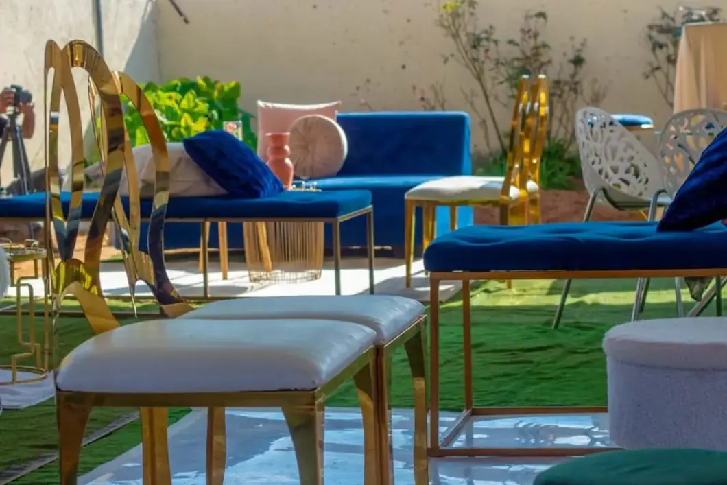 Royal Blue Lounge. Soft velvet blues, sculptural gold seats and warm details create a welcoming lounge.