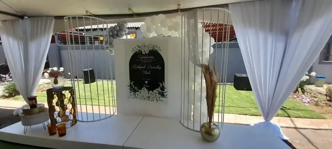 White Tribute Styling. A peaceful, carefully balanced white setting for heartfelt remembrance.