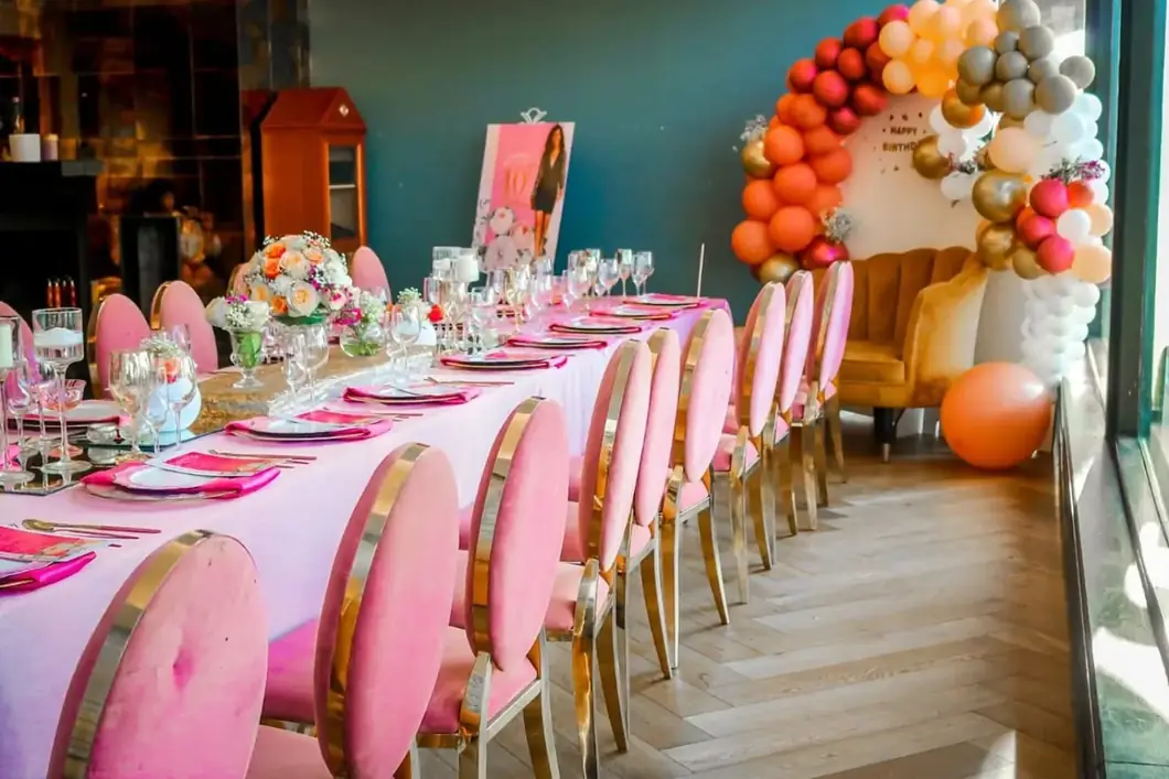 Pink Celebration Dining. A beautifully arranged birthday dining space alive with fresh pink accents.
