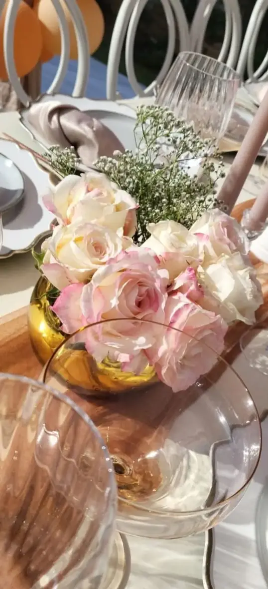 Rose Gold Florals. A luminous arrangement of roses and warm metallic details creates instant atmosphere.