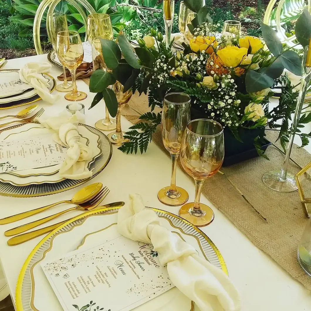 Golden Garden Details. A sunlit floral setting where glass, gold and greenery work together in harmony.